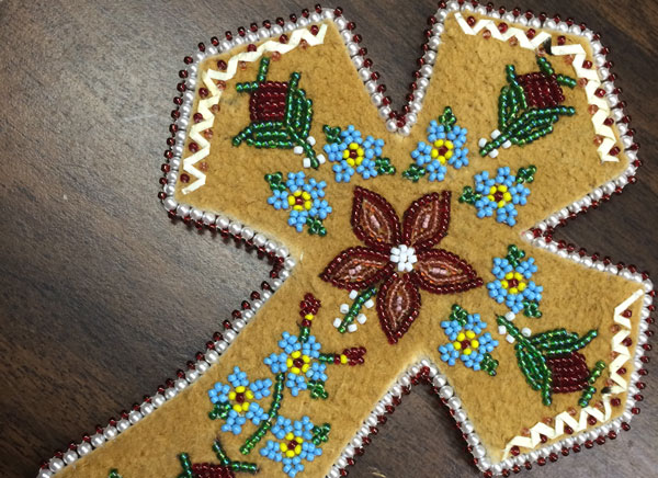 Mary Simms Beading a Cross